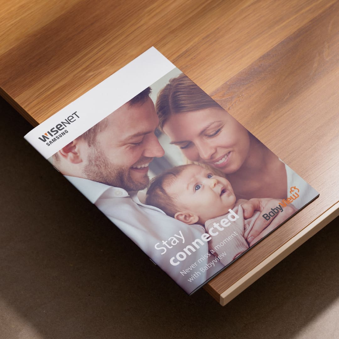 Front cover of a Samsung 'BabyView' camera brochure, featuring a couple with their young baby