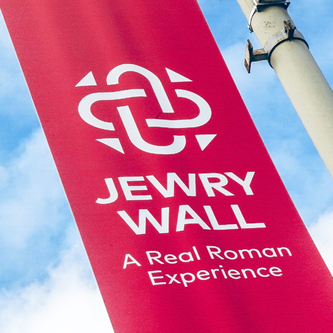 Jewry Wall logo on a red lamppost banner