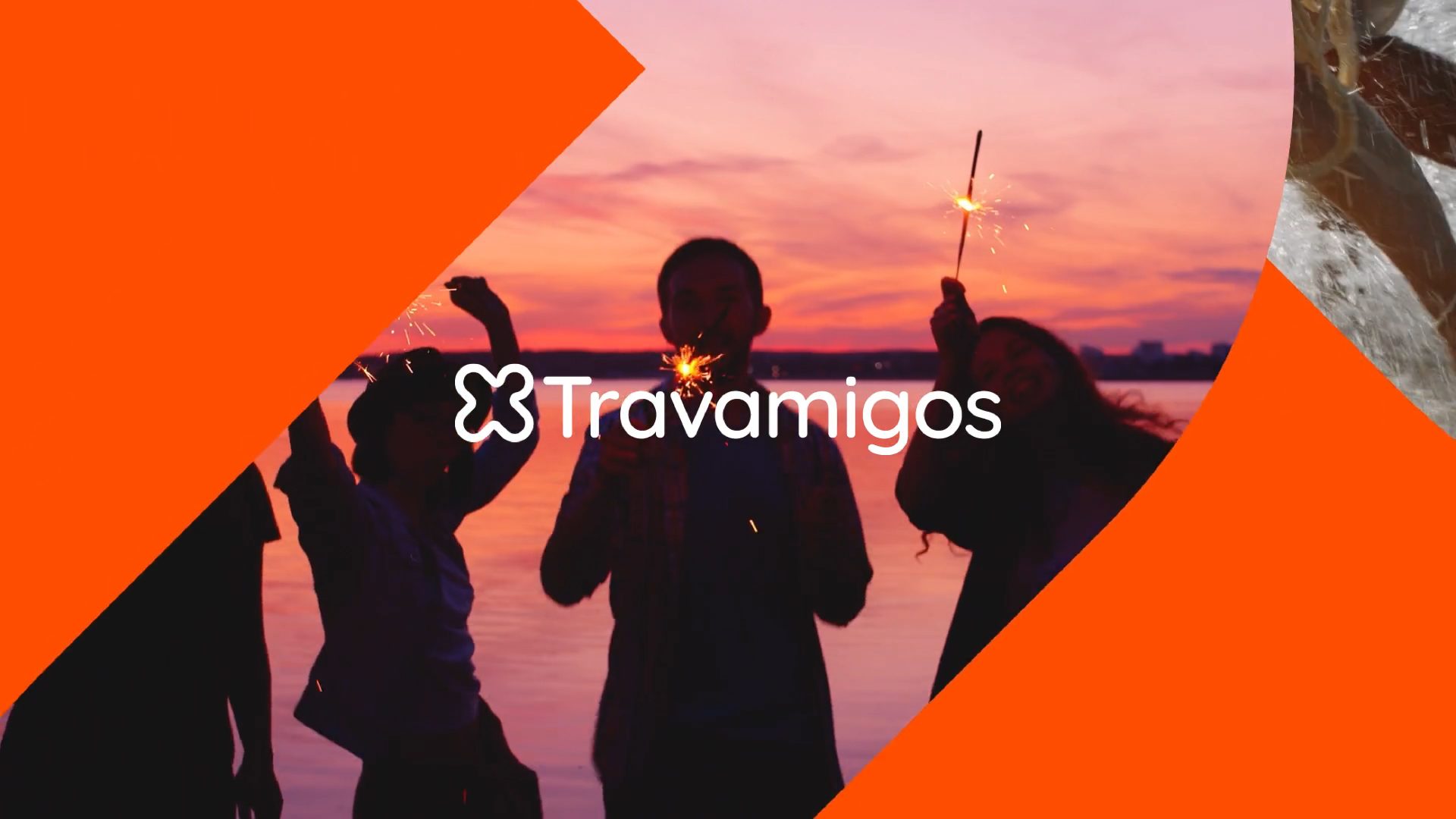 Travamigos logo over photograph of travelling group of friends holder sparklers at sunset