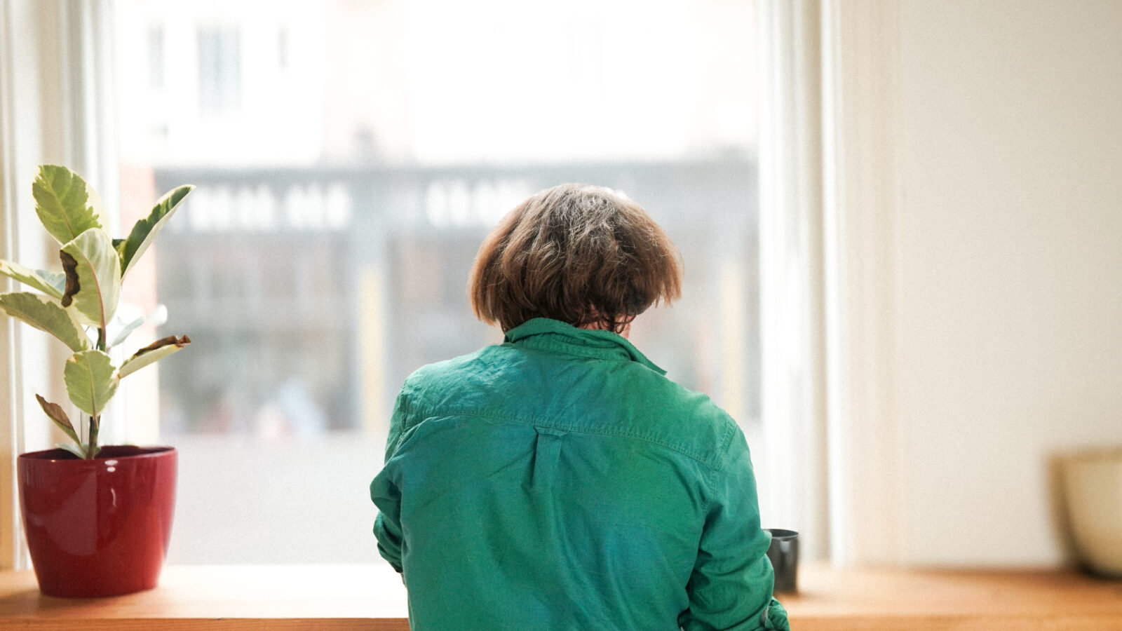 Account Manager, Josh, sitting at the window desk in the studio