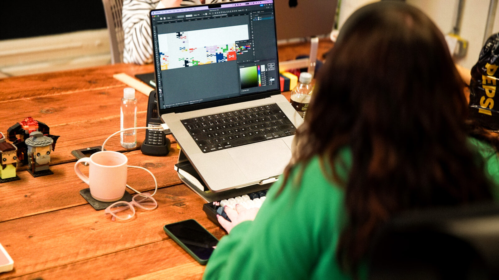 Senior Designer, Sarah, working on a project