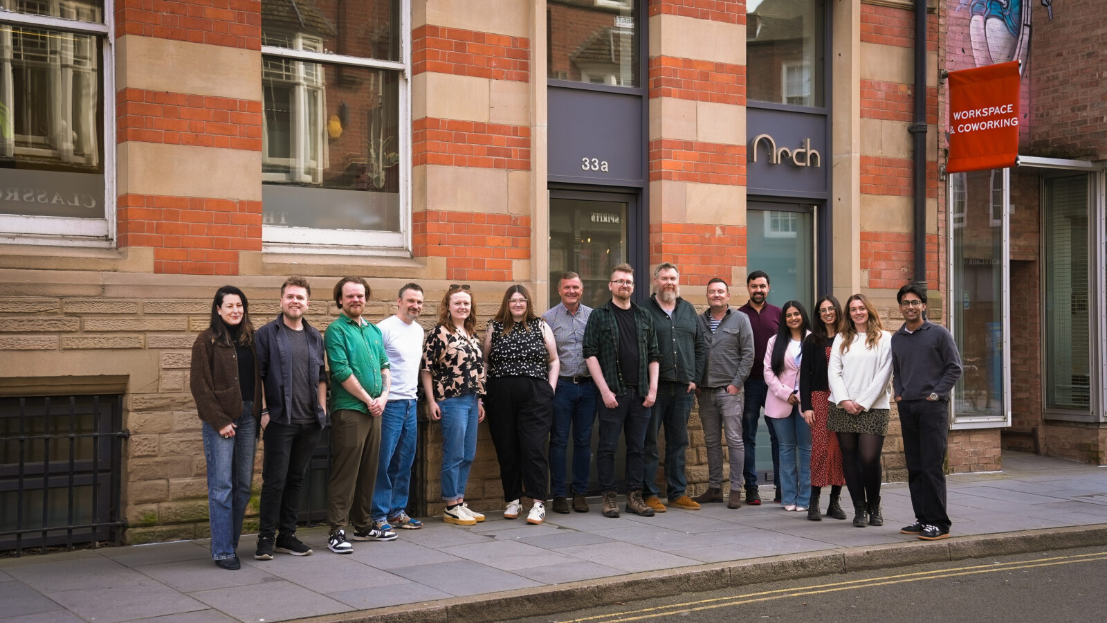 The whole team stood outside the Arch studio